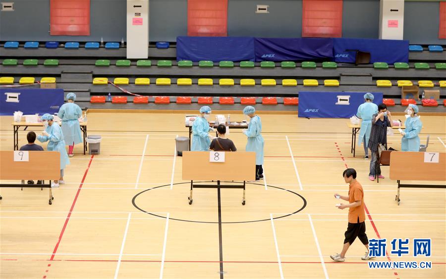 （圖文互動）（4）&ldquo;身為醫(yī)護(hù)人員一分子，應(yīng)該出來幫忙&rdquo;&mdash;&mdash;參與新冠病毒社區(qū)檢測的香港醫(yī)護(hù)人員速寫